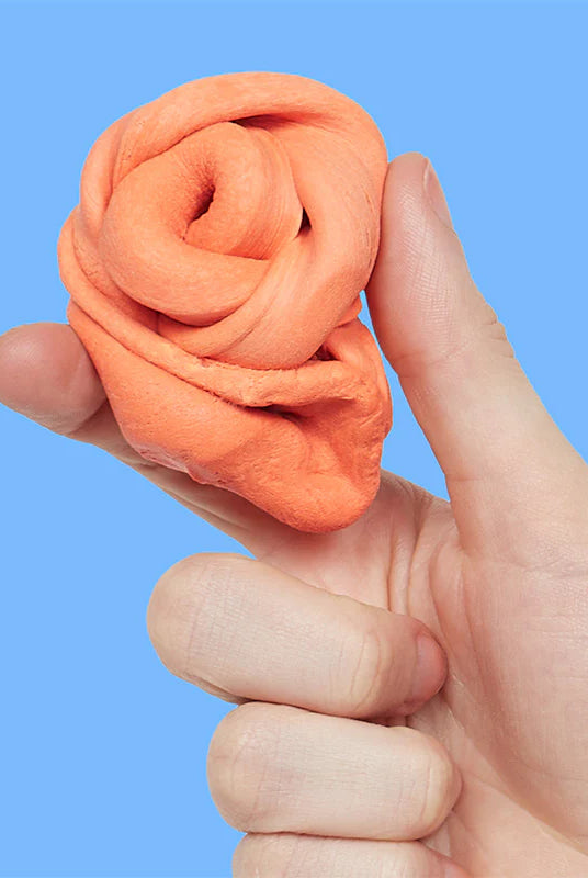 Macro close-up shot of the soft, matte, and aerated silicone texture of Speks Blur sensory putty.
