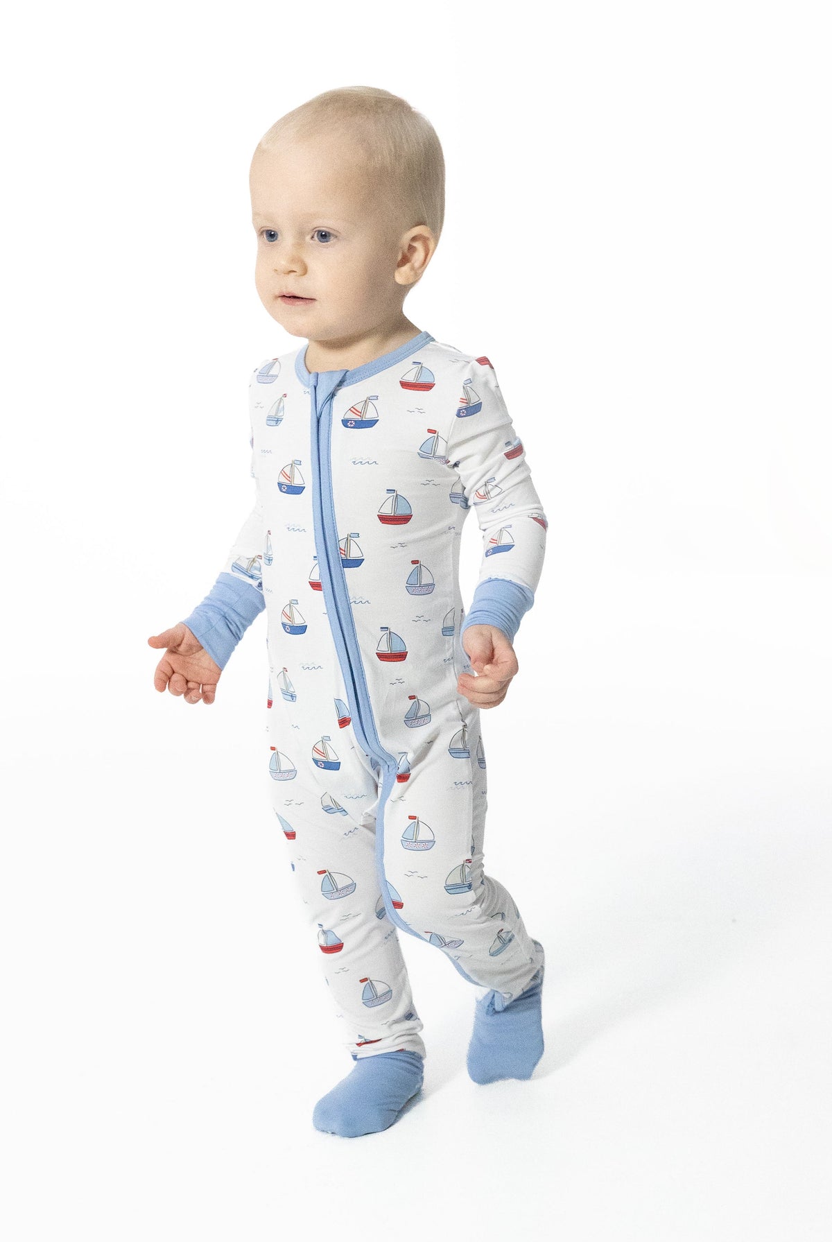 Baby wearing Angel Dear bubbly sailboats zipper romper