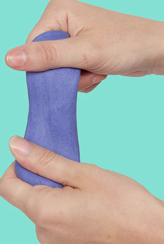 Hands using silent Twilight purple Speks Blur sensory putty to relieve stress.