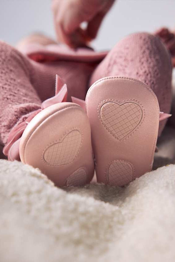 Bottom closeup of crib shoes