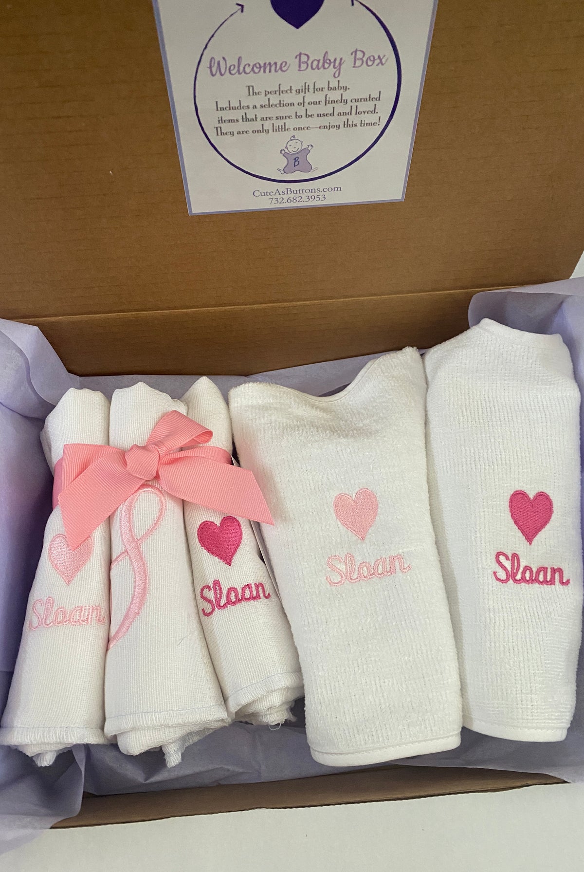 Personalized baby girl gift box with monogrammed burp cloths and bibs