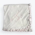 Personalized Pima cotton baby blanket with pink ruffle edge and custom name embroidery