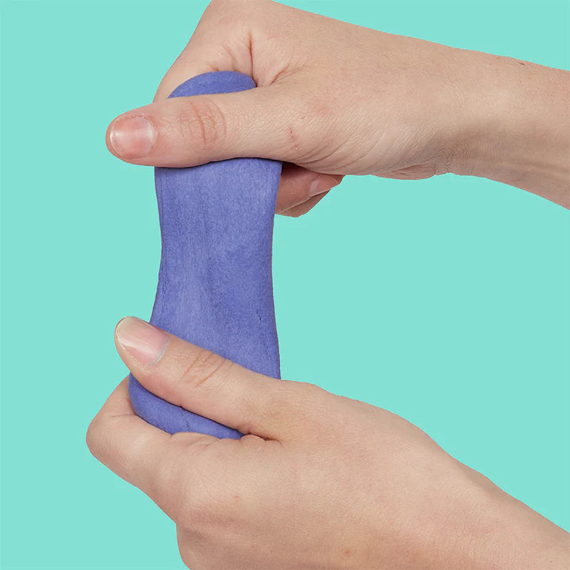 Hands using silent Twilight purple Speks Blur sensory putty to relieve stress.