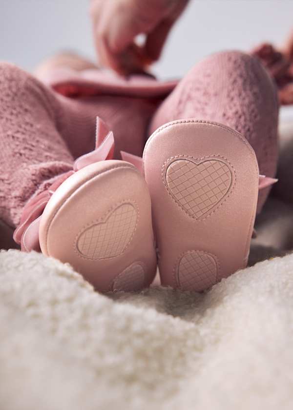 Bottom closeup of crib shoes