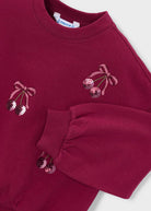 close up of cherries embroidery details