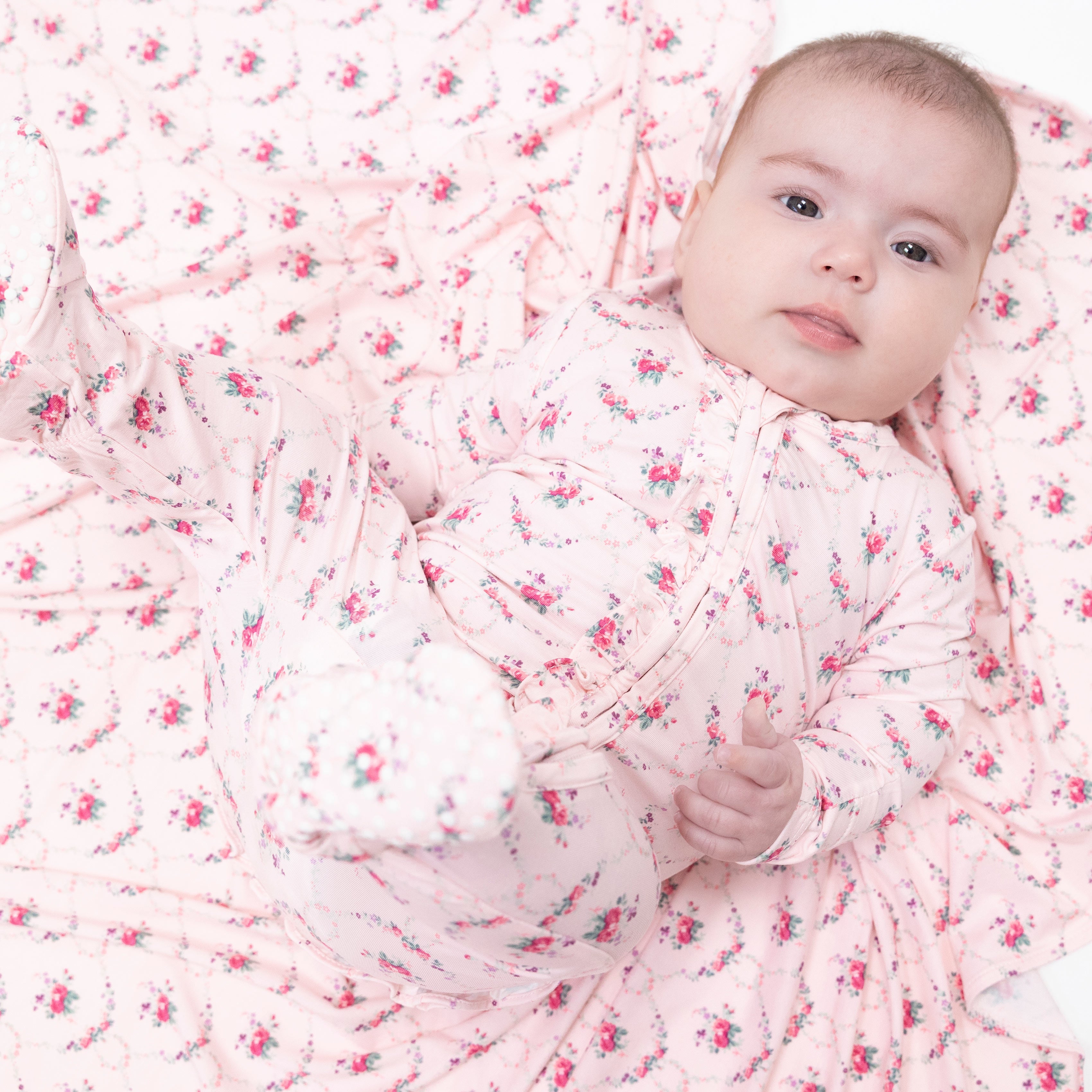 Model wearing the rose garden trellis footie by angel dear