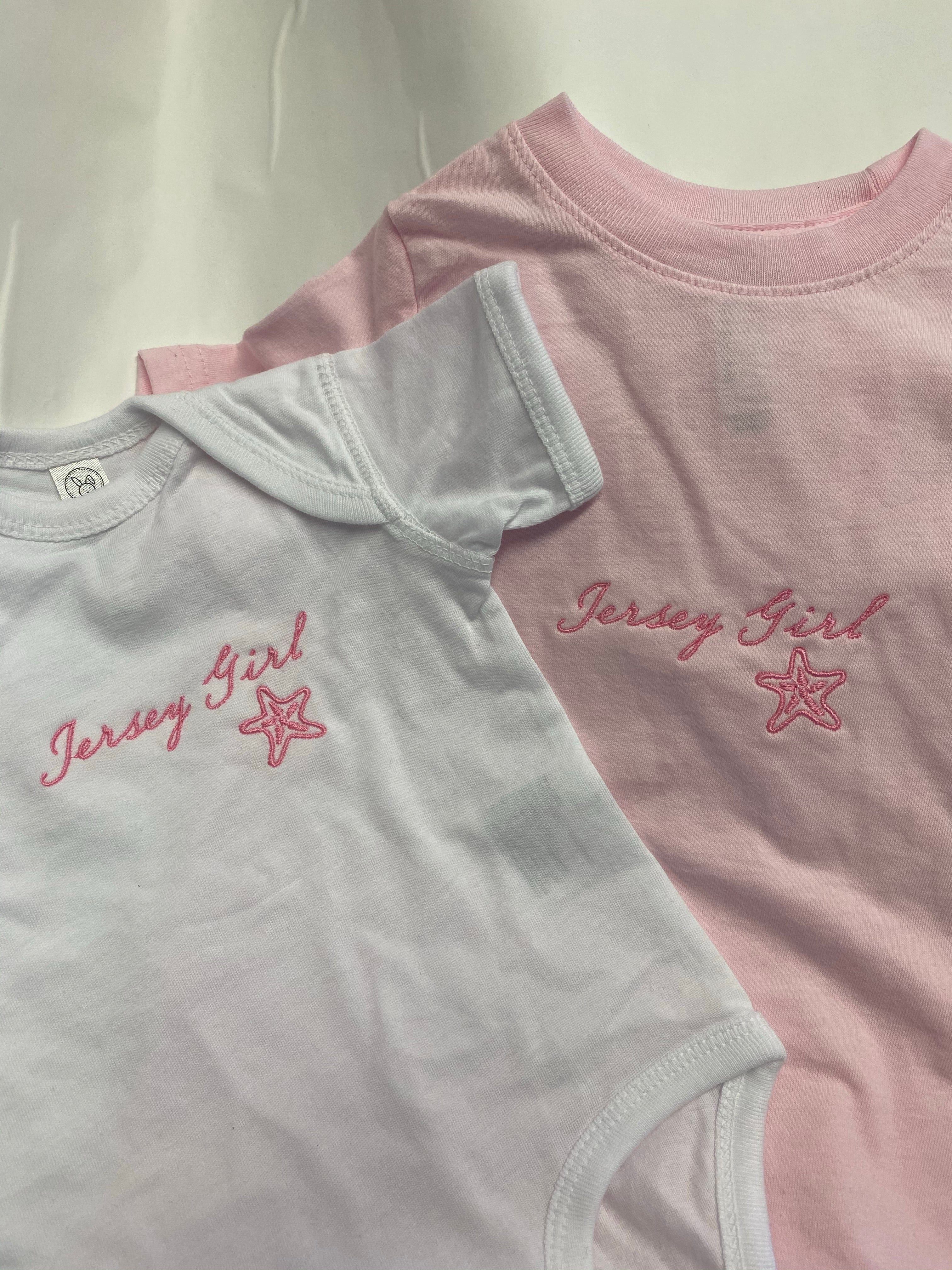 Jersey Girl onesie by Cute as Buttons - pink embroidered starfish design